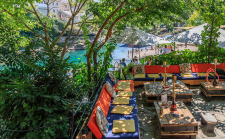 MOSTAR, BOSNIA HERZEGOVINA - 2017 AUGUST 16. Cafe on the banks of the Neretva River.のeditorial素材