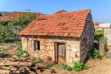 MOSTAR, BOSNIA HERZEGOVINA - 2017 AUGUST 16. Old brick house ruin.のeditorial素材