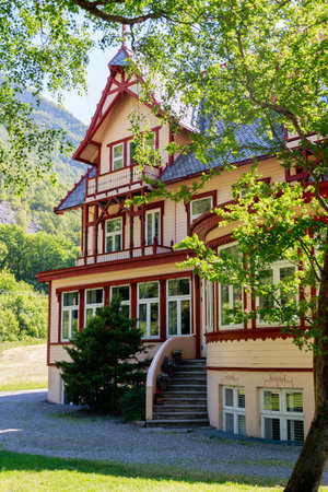 OEYE, NORWAY - 2018 JUNE 09. Historic Hotel Union Oeye cover with green trees.のeditorial素材