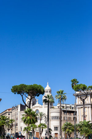 ROME, ITALY - 2014 AUGUST 18. Street photo of green trees and architecture buildings in Rome.のeditorial素材