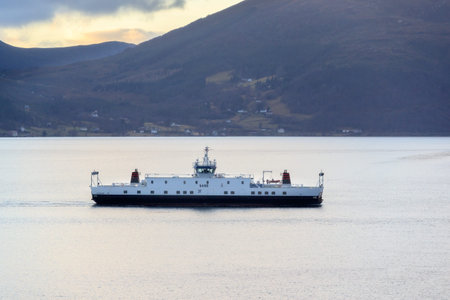 ROVDEFJORDEN, NORWAY - 2016 DECEMBER 05. Car ferry cross the beautiful fjord of Norway.