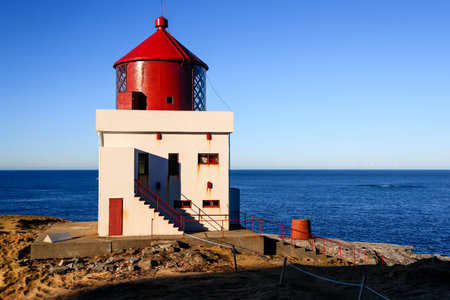 RUNDE, NORWAY - 2018 FEBRUARY 19. Runde Lighthouse in blue skye.のeditorial素材