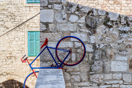 SIBENIK, CROATIA - 2017 AUGUST 18. Blue bicycle in the street of the old city of Sibenikのeditorial素材