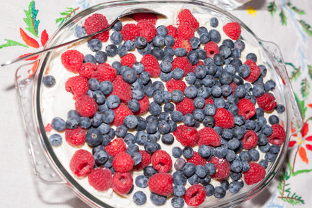 STRYN, NORWAY - 2014 DECEMBER 20. Sweet homemade dessert with raspberrre and blueberry.