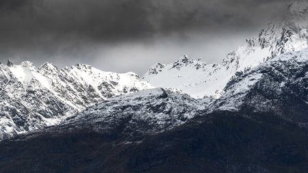 VARTDAL, NORWAY - 2018 OCTOBER 02. Dark clouds and snow on the mountain.のeditorial素材