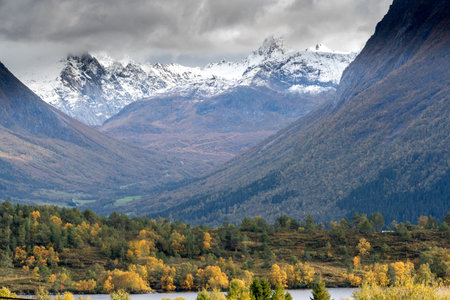 VARTDAL, NORWAY - 2018 OCTOBER 02. Autumn color and new snow on the mountainsのeditorial素材