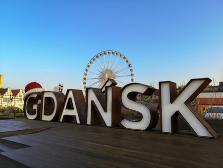 GDANSK, POLAND - 2020 JANUARY 17. Gdansk sign with red Santa Claus hat on.のeditorial素材