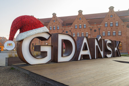 GDANSK, POLAND - 2020 JANUARY 17. Gdansk sign with red Santa Claus hat on.のeditorial素材