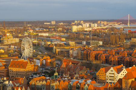 GDANSK, POLAND - 2020 JANUARY 18. City viewed from the top of a cathedral tower with red roof and river in the foreground.のeditorial素材