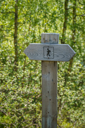 VALLDAL, NORWAY - 2020 JUNE 09. Wooden hiking post showing the hiking direction in Norway.の写真素材