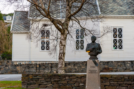 ULSTEINVIK, NORWAY- NOVEMBER 28. Ragnar Ulstein freedom fighter statue in front of Ulsteinvik church.のeditorial素材