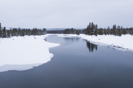 Winter landscape with frozen river in the Great Teton national park.の写真素材