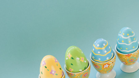 Painted easter eggs in egg cups.の写真素材