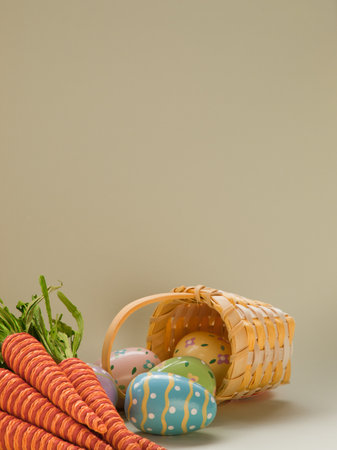 Painted easter eggs with carrots.の写真素材