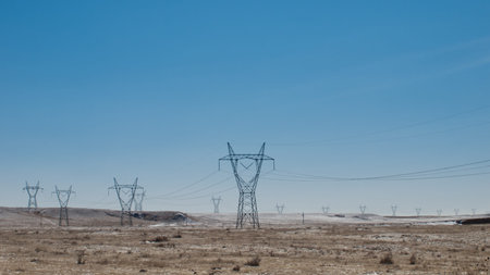 Long lines of powerline towers stretching across a countryside in Fort Collins, Colorado.