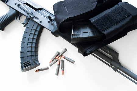 Custom painted AK-47 with a 30 round magazine and a folding stock.