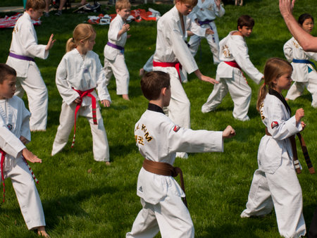 Belt test at J.W. Kim TaeKwonDo School. At the park in Greenwood Village, Colorado. June 2011.のeditorial素材