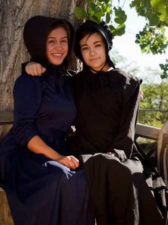 Two amish girls on the bench.のeditorial素材