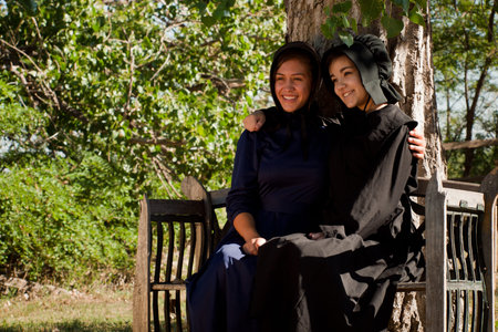 Two amish girls on the bench.のeditorial素材