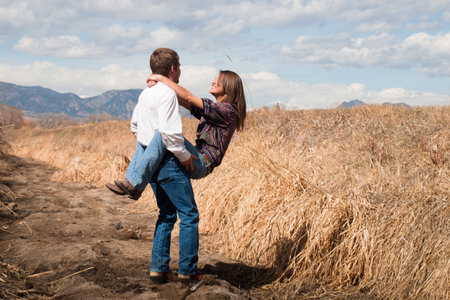 Country swing dancing at the foothill of mountains.の写真素材