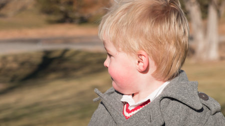 Toddler boy having a great day in the park.