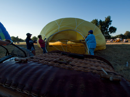 Hot air balloons in a field during a festival in Loveland, Colorado.のeditorial素材