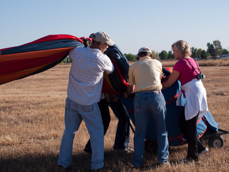 Hot air balloons in a field during a festival in Loveland, Colorado.のeditorial素材
