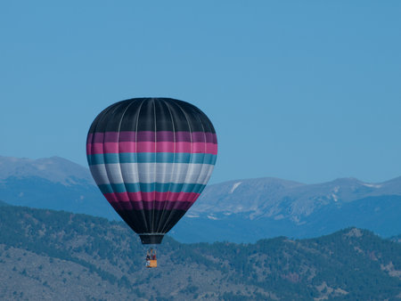 Hot air balloons in a field during a festival in Loveland, Colorado.のeditorial素材