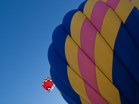 Hot air balloons in a field during a festival in Loveland, Colorado.のeditorial素材