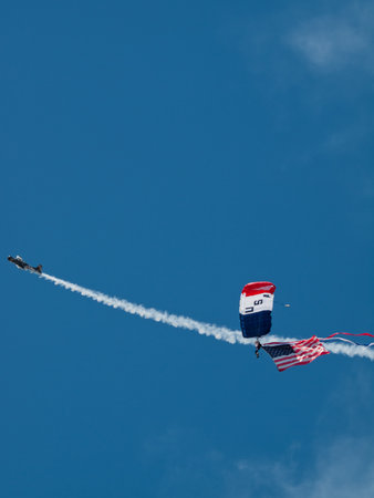 Walter Green flying the American flag at the Rocky Mountain Airshow in Broomfield, Colorado.のeditorial素材