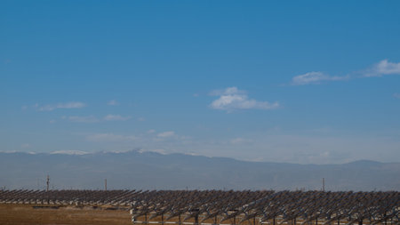 A series of large solar panels forms a symmetrical line at a power plant in the San Luis Valley of...