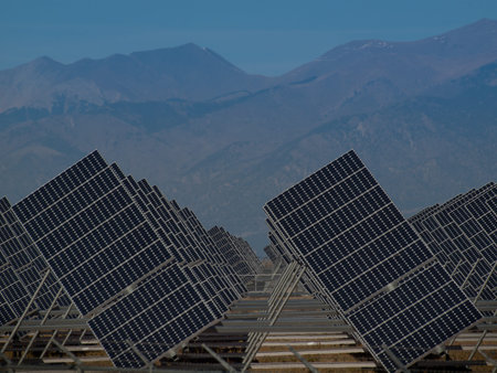 A series of large solar panels forms a symmetrical line at a power plant in the San Luis Valley of...