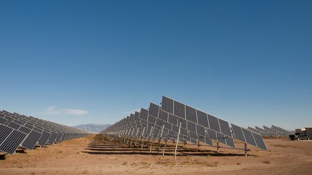 A series of large solar panels forms a symmetrical line at a power plant in the San Luis Valley of...