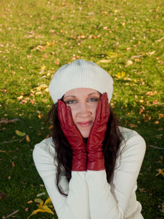Young woman in autumn park.の写真素材