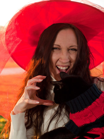 Young woman in autumn park.の写真素材