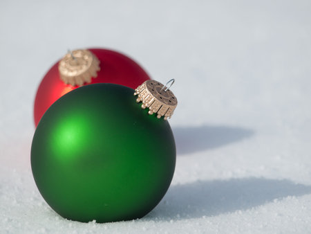 Christmas ornaments in virgin snow.の写真素材