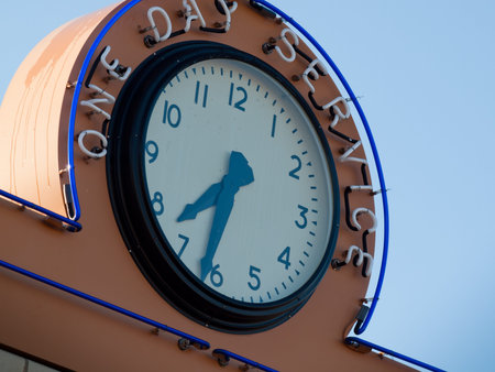 Clock on Ethel's Beauty Salon and 88¢ Variety Store at the Lakewood Heritage Center, Colorado.のeditorial素材