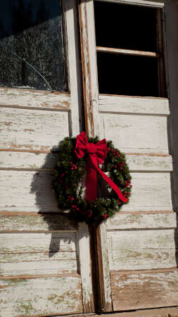 Old house decorated for the winter holidays.の写真素材