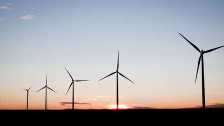 Wind turbines farm at sunset in Limon, Colorado.の写真素材