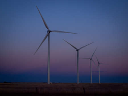 Wind turbines farm at sunset in Limon, Colorado.の写真素材