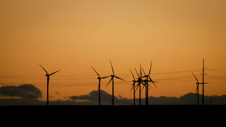 Wind turbines farm at sunset in Limon, Colorado.