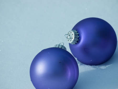 Christmas ornaments in virgin snow.の写真素材