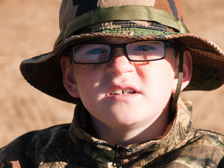 Young boy at the shooting range.の写真素材