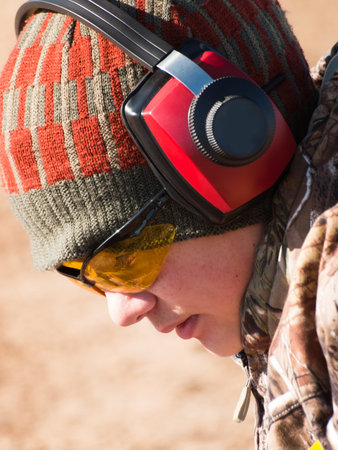 Young boy at the shooting range.