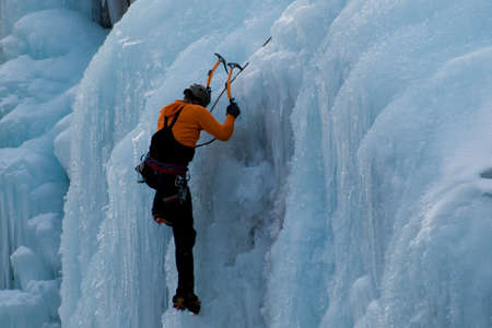 Alpinist ascenting a frozen waterfall in Ice park, Ouray.のeditorial素材