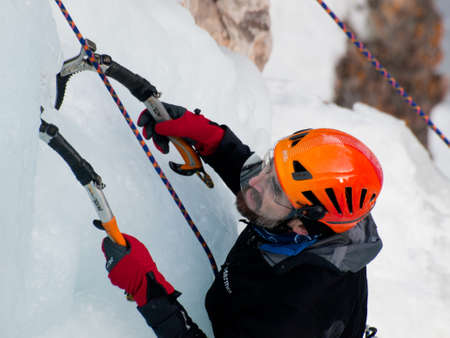 Alpinist ascenting a frozen waterfall in Ice park, Ouray.のeditorial素材