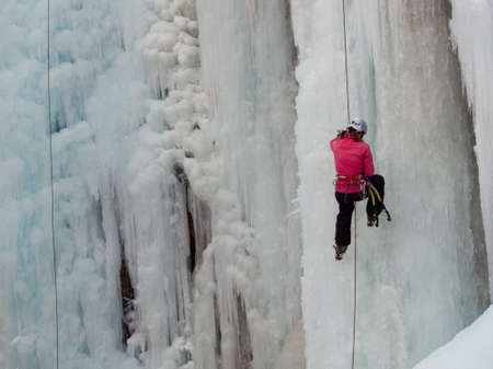 Alpinist ascenting a frozen waterfall in Ice park, Ouray.のeditorial素材