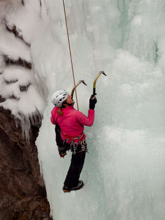Alpinist ascenting a frozen waterfall in Ice park, Ouray.のeditorial素材