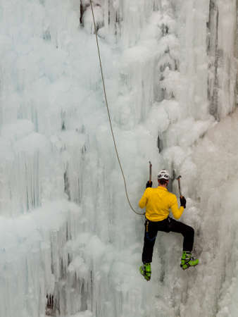 Alpinist ascenting a frozen waterfall in Ice park, Ouray.のeditorial素材