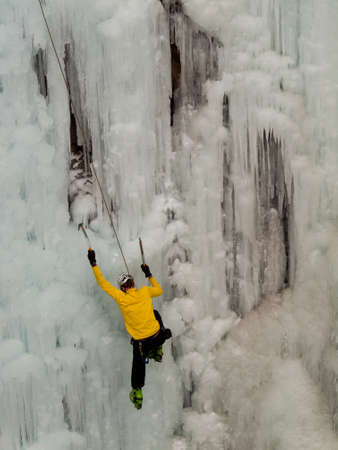 Alpinist ascenting a frozen waterfall in Ice park, Ouray.のeditorial素材